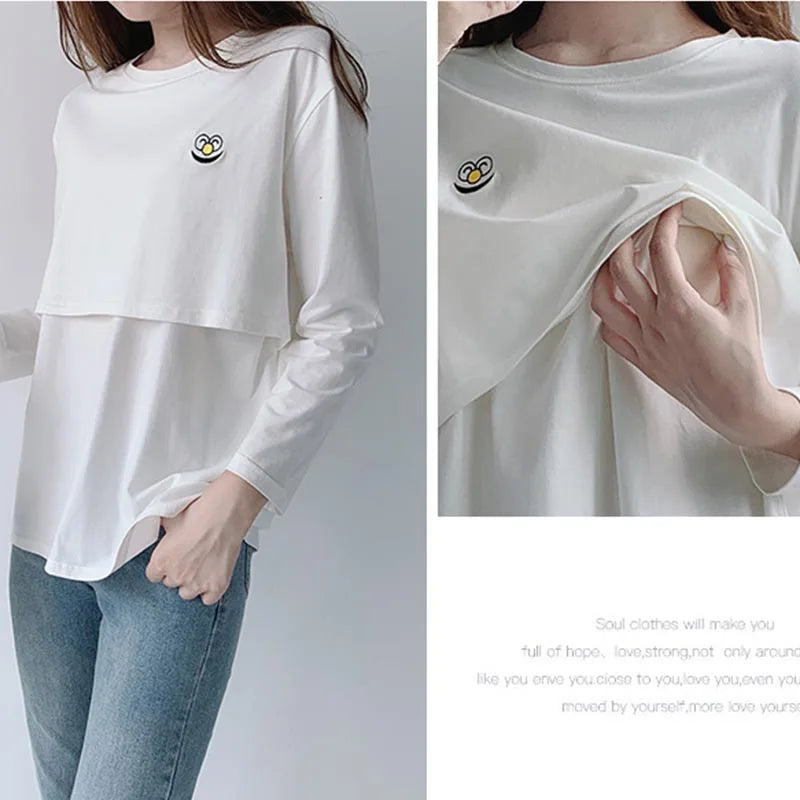 White long-sleeve shirt with a small design on a plain background